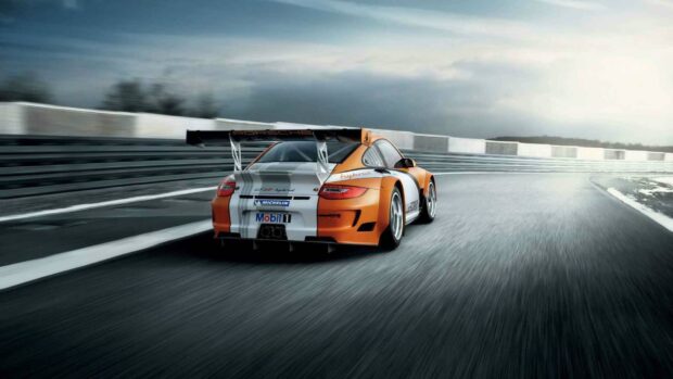 A Porsche race car speeds along a curving circuit in the racing game wallpapers, HD Desktop Wallpaper