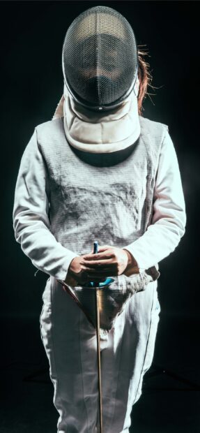 The image shows a fencing athlete holding a sword while wearing protective gear and mask, 2K Mobile Wallpaper