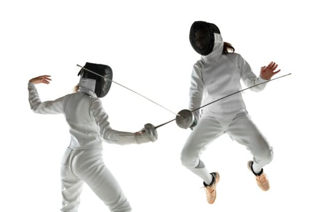 Two athletes engage in a fencing duel with swords and protective gear, 2K Desktop Wallpaper