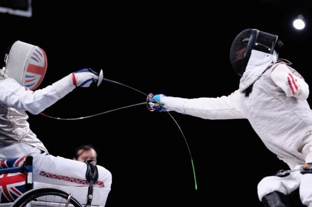 Two athletes compete in fencing with swords during a match, HD Desktop Wallpaper