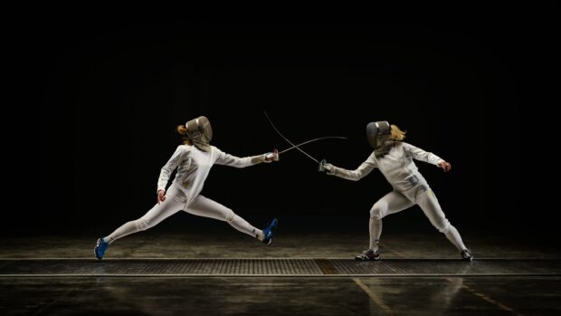 Two athletes engage in a fencing duel with crossed swords, 2K Desktop Wallpaper