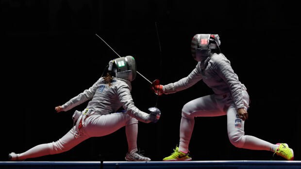 Two fencers compete intensely in a fencing match wearing protective gear, HD Desktop Wallpaper
