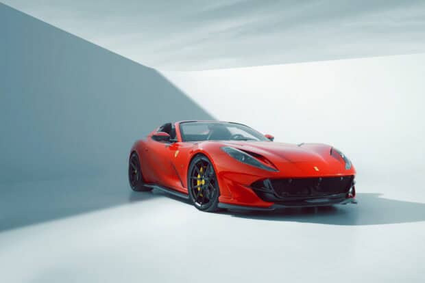 A red Ferrari 812 Gts is parked inside a minimalist white studio with bright lighting and sharp shadows, HD Desktop Wallpaper
