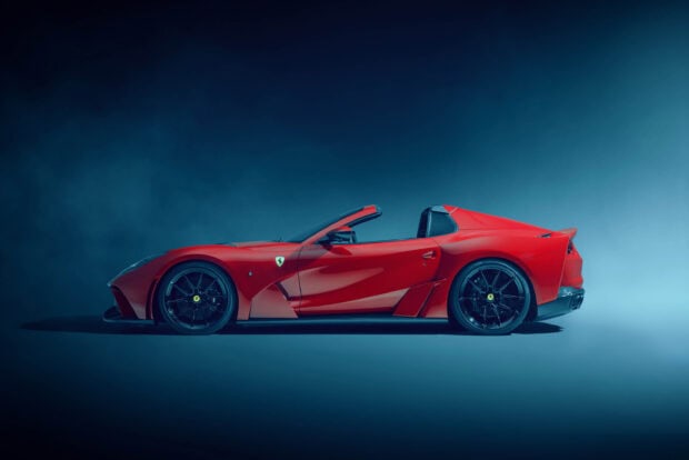 A sleek red Ferrari 812 Gts convertible sports car is captured in a studio setting, 2K Desktop Wallpaper