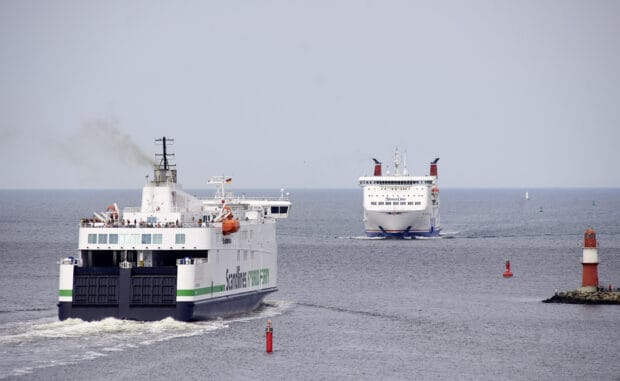 Two ferries are sailing peacefully on the open sea near navigation buoys, 2K Desktop Wallpaper