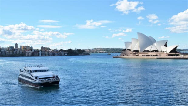 A ferry sails past the Sydney Opera House on clear blue water, HD Desktop Wallpaper