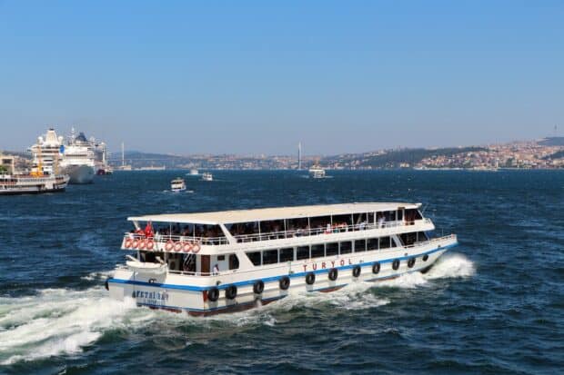 A ferry cruising through the sea with a city and bridge in the background captured in clear weather with Ferry Wallpapers, HD Desktop Wallpaper