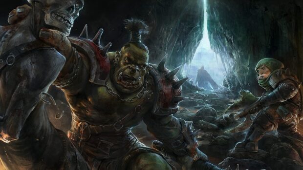 A fierce orc warrior prepares to battle inside a dark cave filled with rocks and enemies, HD Desktop Wallpaper