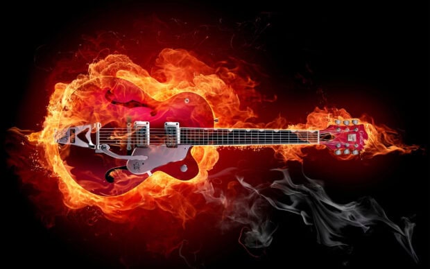 A hard rock guitar engulfed in bright flames symbolizing intensity and power, 2K Desktop Wallpaper