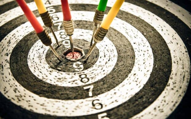 A close up of five darts hitting the bullseye on a dartboard, 2K Desktop Wallpaper