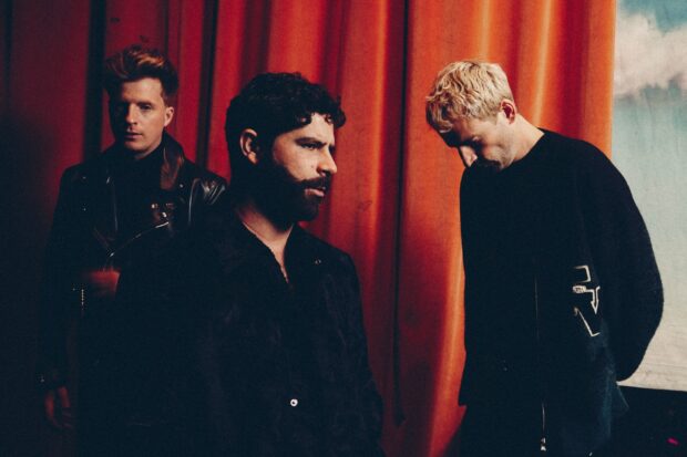 The Foals Band members stand in front of a red curtain with serious expressions, HD Desktop Wallpaper