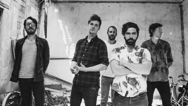 The Foals band stands together in an urban setting showing their unique style and presence, HD Desktop Wallpaper
