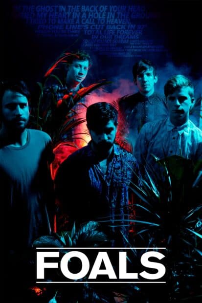The Foals band stands amid vibrant plants and dramatic lighting in this image, 2K Mobile Wallpaper