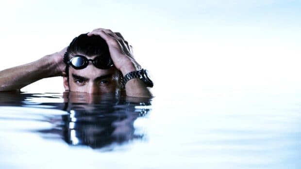 Michael Phelps is partially submerged in water wearing swimming goggles, HD Desktop Wallpaper