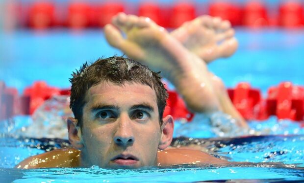 Michael Phelps is concentrating in the pool during a swim event, HD Desktop Wallpaper