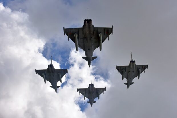 A formation of jet fighters flying through the sky on a cloudy day, HD Desktop Wallpaper