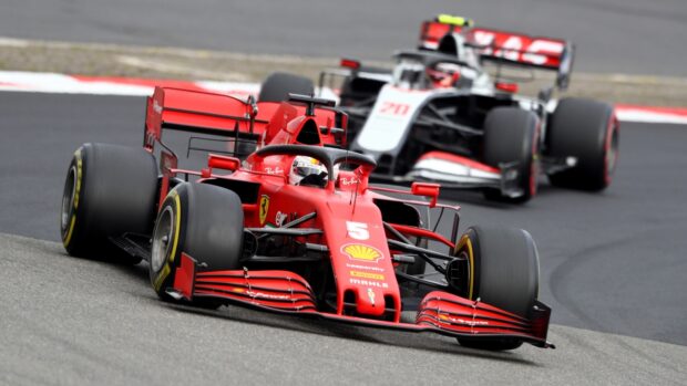 Two high speed F1 cars compete closely on the race track during a race, HD Desktop Wallpaper