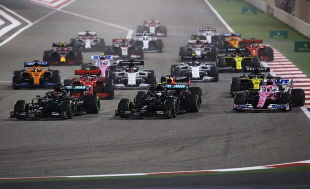 F1 race cars competing on a high speed circuit during a race, HD Desktop Wallpaper