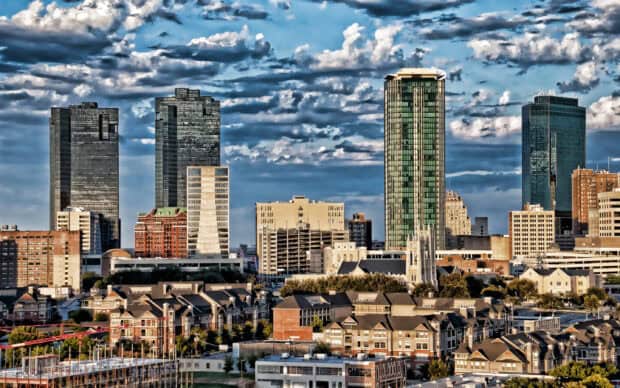 The Fort Worth city skyline shows tall buildings under a cloudy sky, 2K Desktop Wallpaper