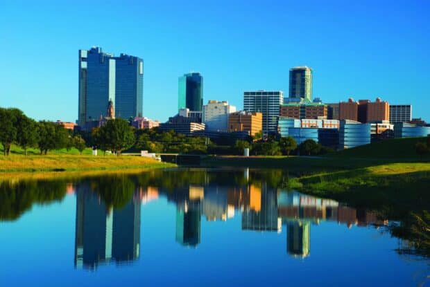 Fort Worth Wallpapers captured with clear blue sky and buildings reflected in water, 2K Desktop Wallpaper