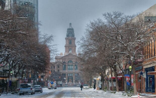 A snowy street view with Fort Worth city hall and bare trees lining the road, HD Desktop Wallpaper