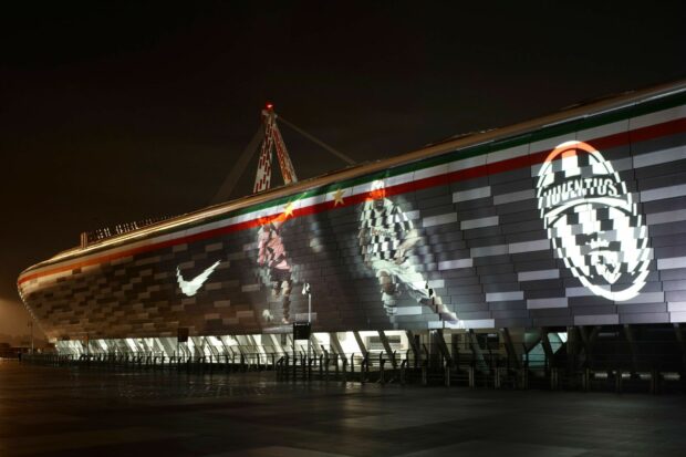 The Forza Juve wallpapers show Juventus graphics lit up on a stadium exterior at night, HD Desktop Wallpaper
