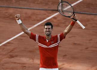 A tennis player celebrates victory on the clay court during the French Open Roland Garros, 2K Desktop Wallpaper