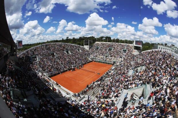 A packed stadium for French Open Roland Garros with spectators watching a clay court match, 2K Desktop Wallpaper