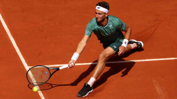 A tennis player stretches to hit the ball on clay court during the French Open Roland Garros, HD Desktop Wallpaper
