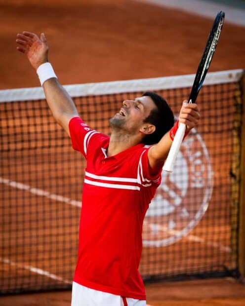 A tennis player celebrates victory at French Open Roland Garros on clay court, HD Mobile Wallpaper