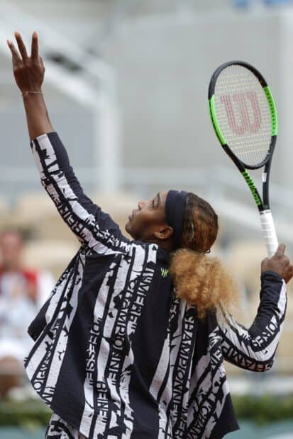 A tennis player is serving during the French Open Roland Garros match, 2K Mobile Wallpaper