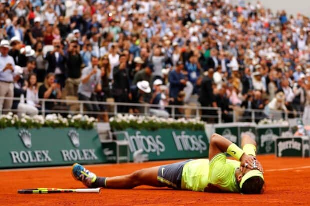 A tennis player lies on the clay court at the French Open Roland Garros after a match, HD Desktop Wallpaper
