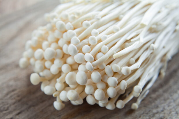 A bunch of enoki mushrooms on wooden surface, HD Desktop Wallpaper