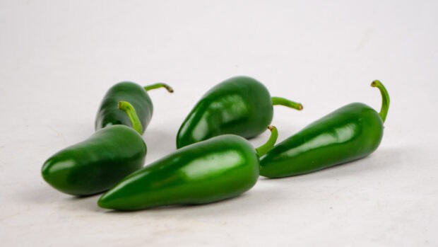 Five fresh green jalapeno peppers lie on a white surface for jalapeno wallpapers, HD Desktop Wallpaper