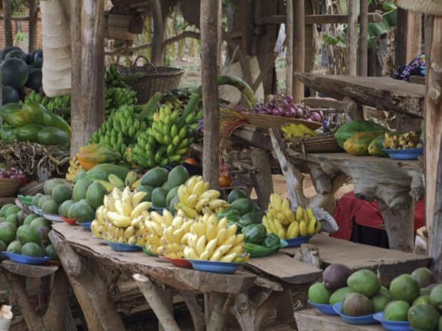 A variety of fresh tropical fruits are displayed at a market in Uganda, HD Desktop Wallpaper