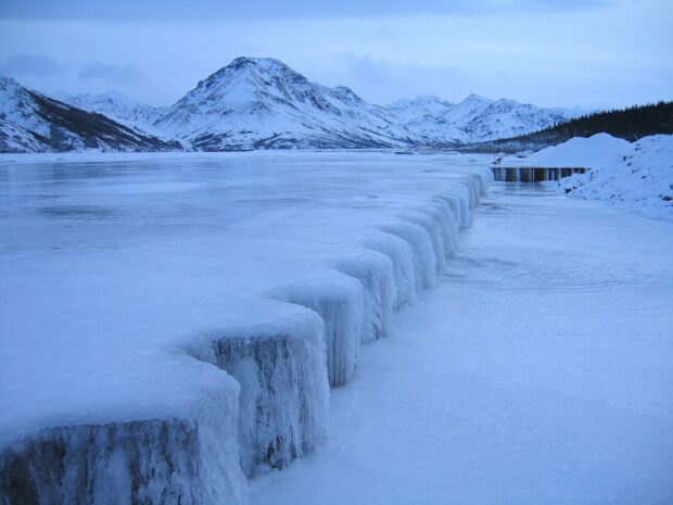 A frozen dam and snow covered mountains are seen at Denali National Park and Preserve, HD Desktop Wallpaper