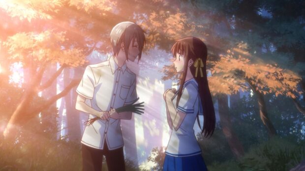 A boy and girl share a tender moment in a sunlit forest in Fruits Basket anime, HD Desktop Wallpaper