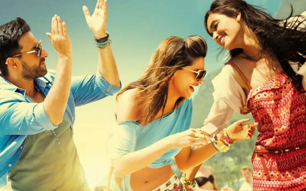 A joyful group enjoying a sunny day outdoors in Bollywood Wallpapers style, 2K Desktop Wallpaper