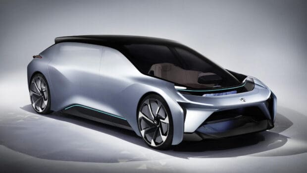 A silver Nio auto is displayed with sleek futuristic design and large wheels, HD Desktop Wallpaper