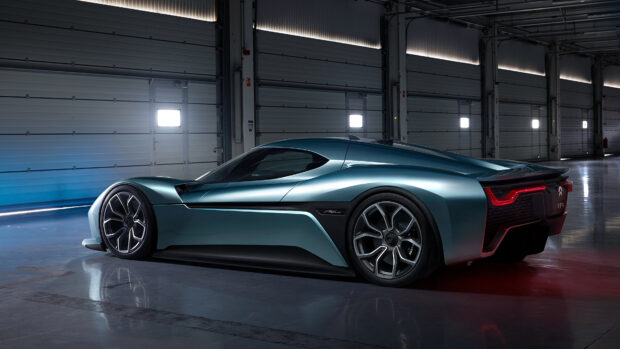 A sleek blue Nio auto is parked inside a modern garage with bright windows, 4K Desktop Wallpaper