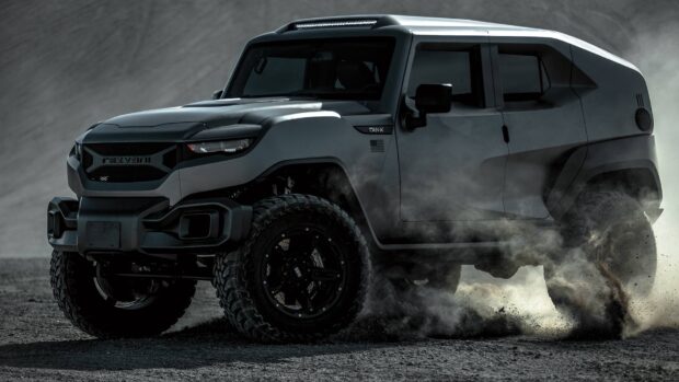 A rugged off road vehicle powers through dirt with dust swirling around the tires, HD Desktop Wallpaper