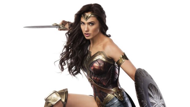 Gal Gadot as Wonder Woman holding a sword and shield in a dynamic stance, 2K Desktop Wallpaper