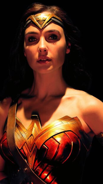 Gal Gadot Wonder Woman wallpapers show a focused close up of her face and armor, HD Mobile Wallpaper