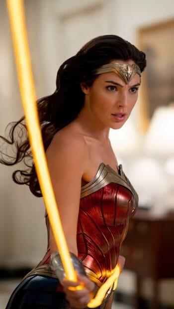 Gal Gadot Wonder Woman Wallpapers is shown wielding her glowing lasso with focused determination, 2K Mobile Wallpaper
