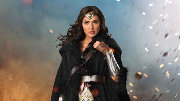 Gal Gadot as Wonder Woman stands confidently wearing her iconic armor and cape, 2K Desktop Wallpaper