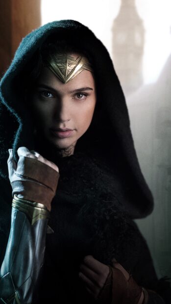 Gal Gadot as Wonder Woman wears a hooded cloak with a determined expression, 4K Phone Wallpaper