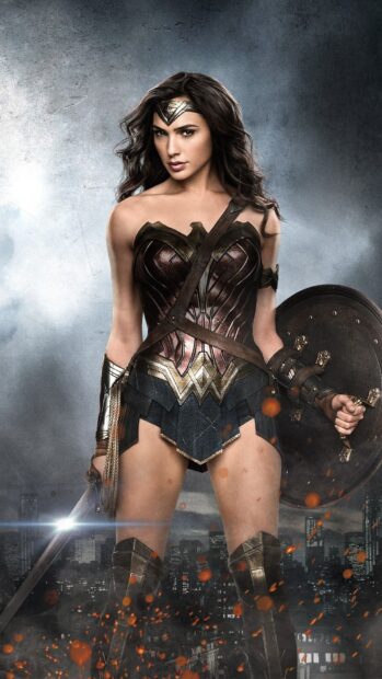 Gal Gadot in Wonder Woman armor standing ready for battle with sword and shield, HD Phone Wallpaper