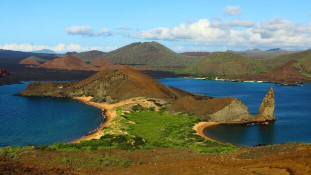 The Galapagos Islands show a unique volcanic landscape surrounded by deep blue sea, HD Desktop Wallpaper