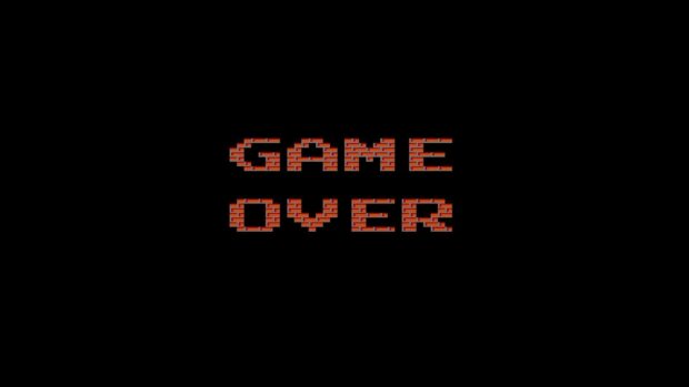 The image shows the phrase Game Over with a brick wall texture on a black background, HD Desktop Wallpaper