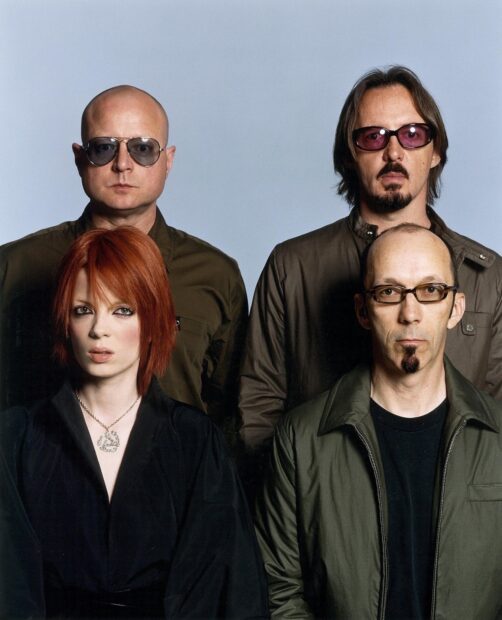 The Garbage Band members stand closely posing for a studio portrait, HD Desktop Wallpaper